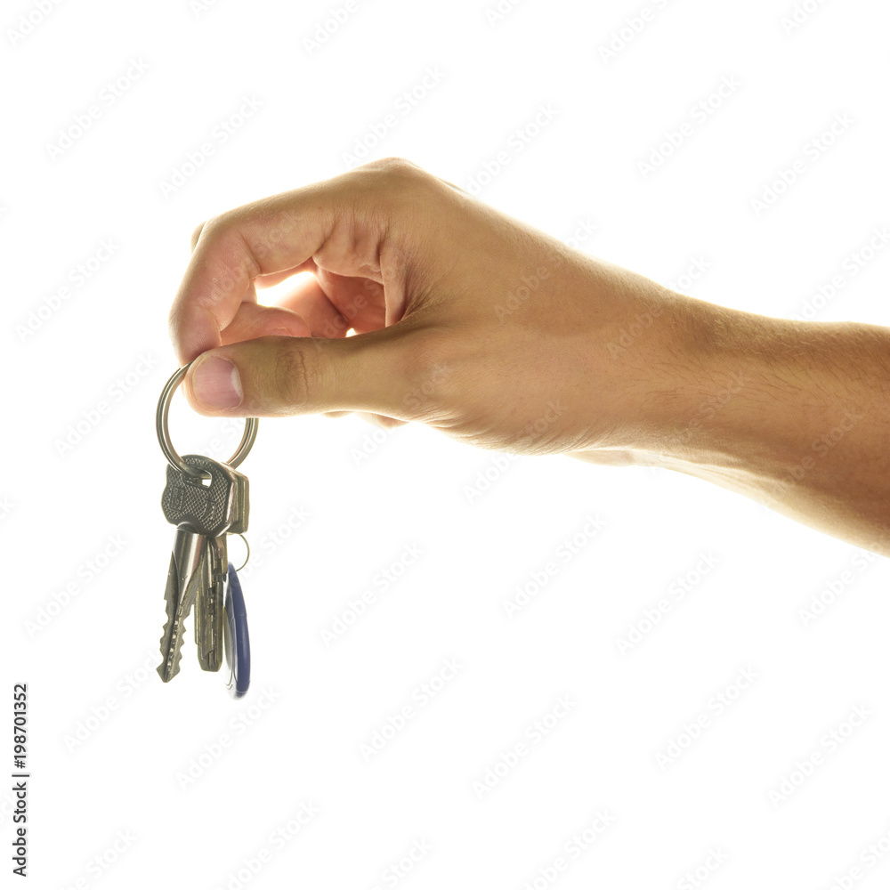Hand holding a key. Key apartment deal purchase concept on white isolated background. Hand holding a key. Key apartment deal purchase concept on white isolated background.