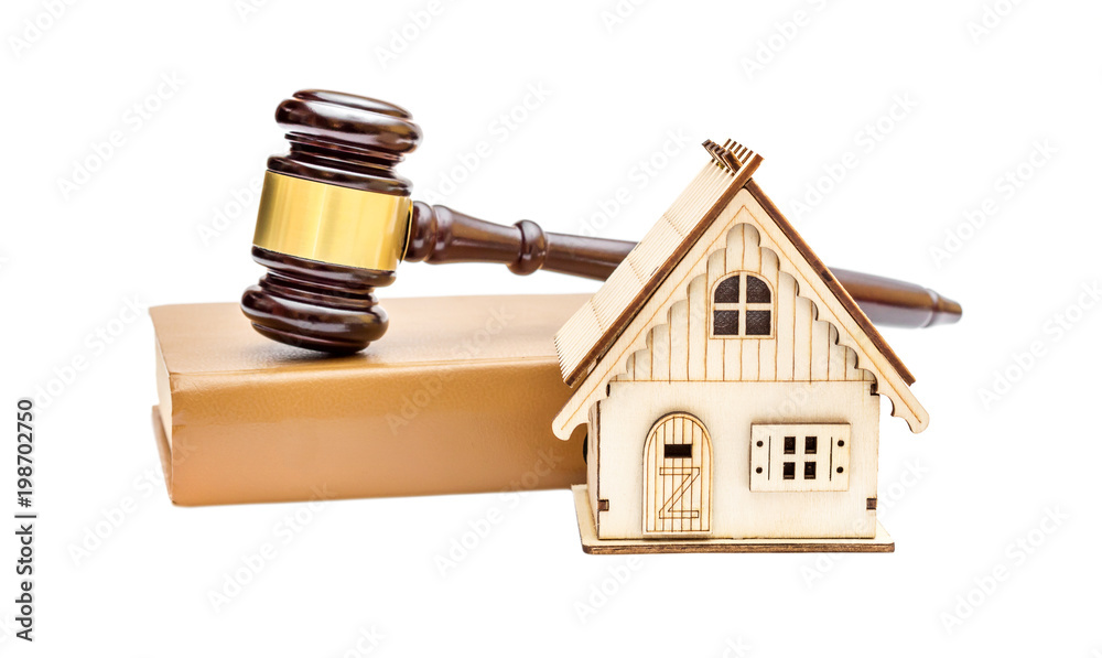 Real estate law. House auction. Model of house with gavel and law book on white background. Real estate law. House auction. Model of house with gavel and law book on white background.