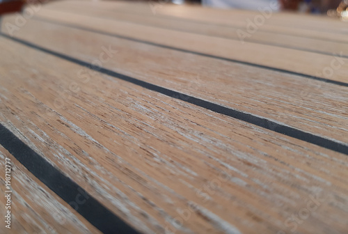The surface of the new teak deck. Radial cutting of wood.