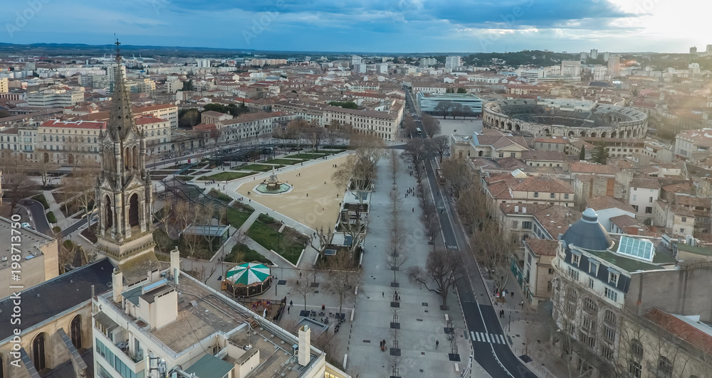 Aerial view of the bell tower of the Catholic Church and the Central square of Nimes in France