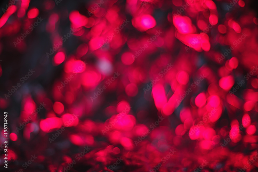 Modern abstract blurred foil background lit by bright pink lamp Modern abstract blurred foil background lit by bright pink lamp