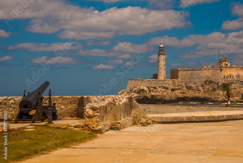 The old colonial castle of San Salvador de la Punta. Gun at the walls of the ruined. Castillo Del Morro lighthouse. Havana, Cuba.