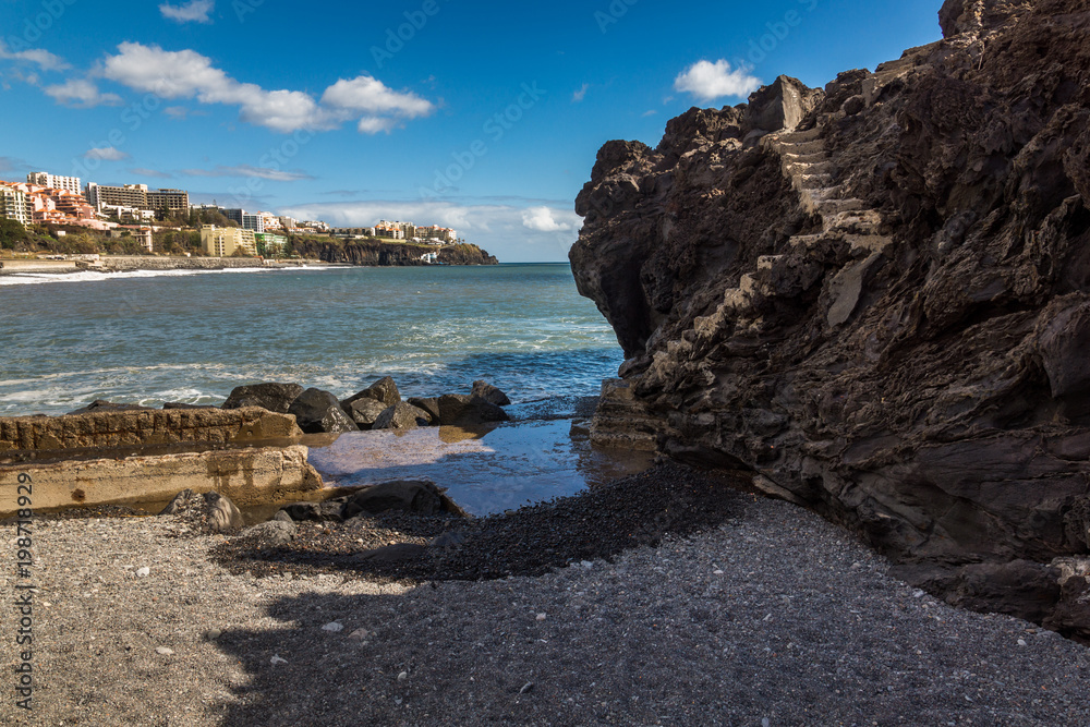 Volcanic rock on the beach in Funchal on Madeira island, Portugal