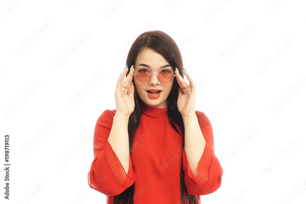 Beautiful woman in red dress with beautiful body hold the red glasses Beautiful woman in red dress with beautiful body hold the red glasses