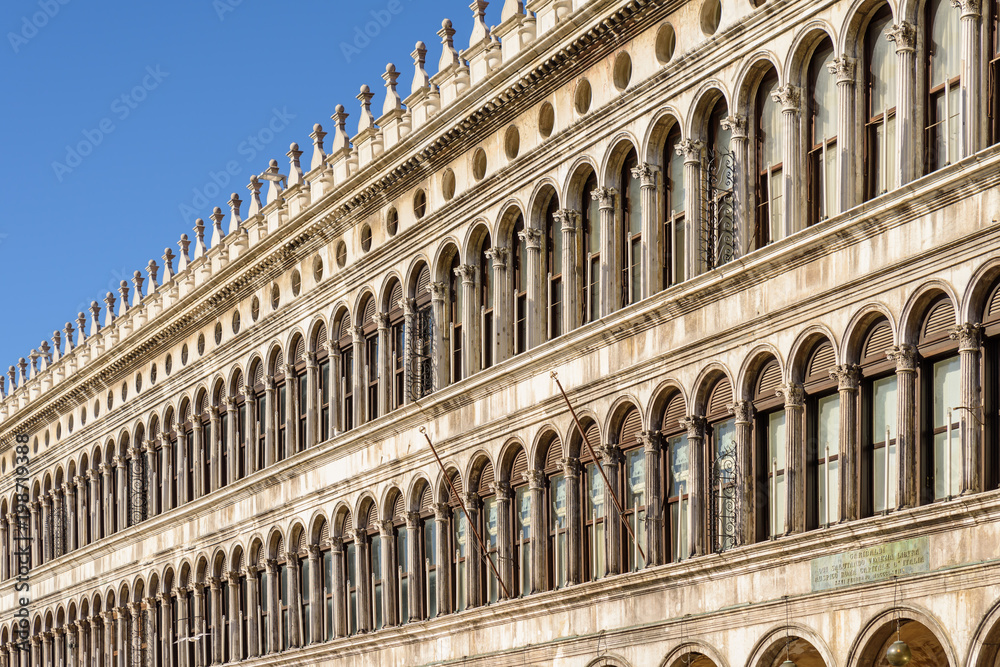 Arch windows of the facade on Piazza San Marco (Saint Mark square) in Venice, Italy.
