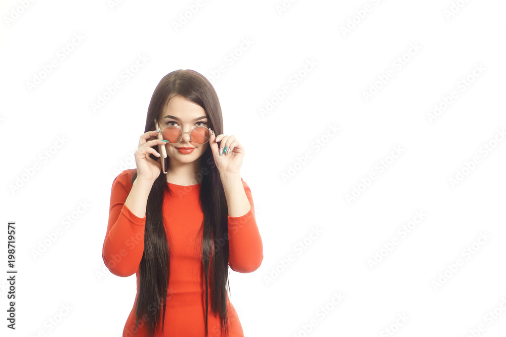 happy woman in red talking on mobile phone and showing gestures by hand. isolated on white background