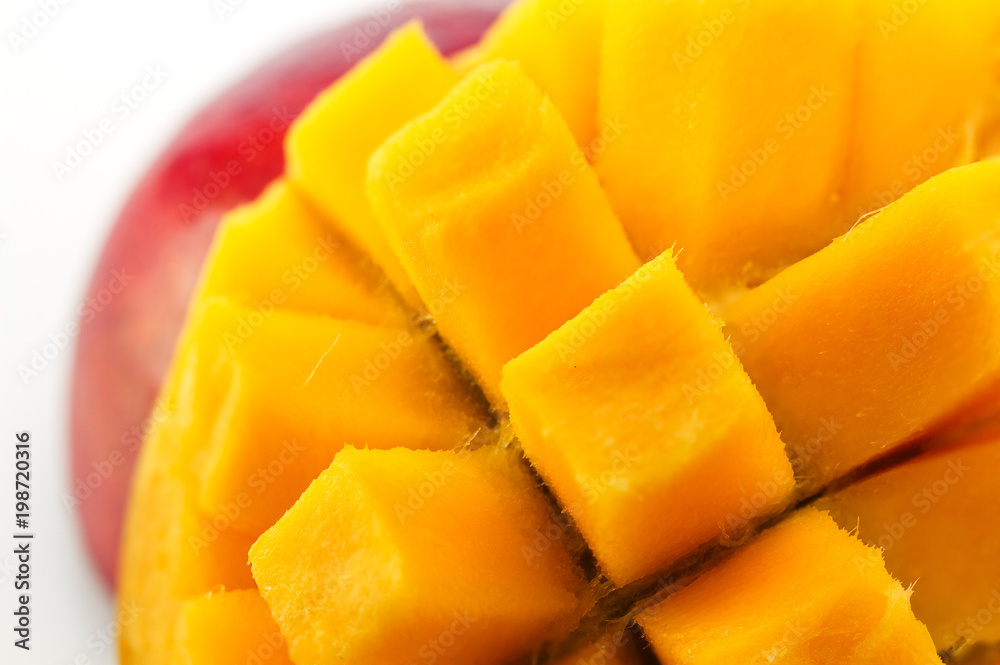 Ripe, juicy and appetizing mango and its parts close-up