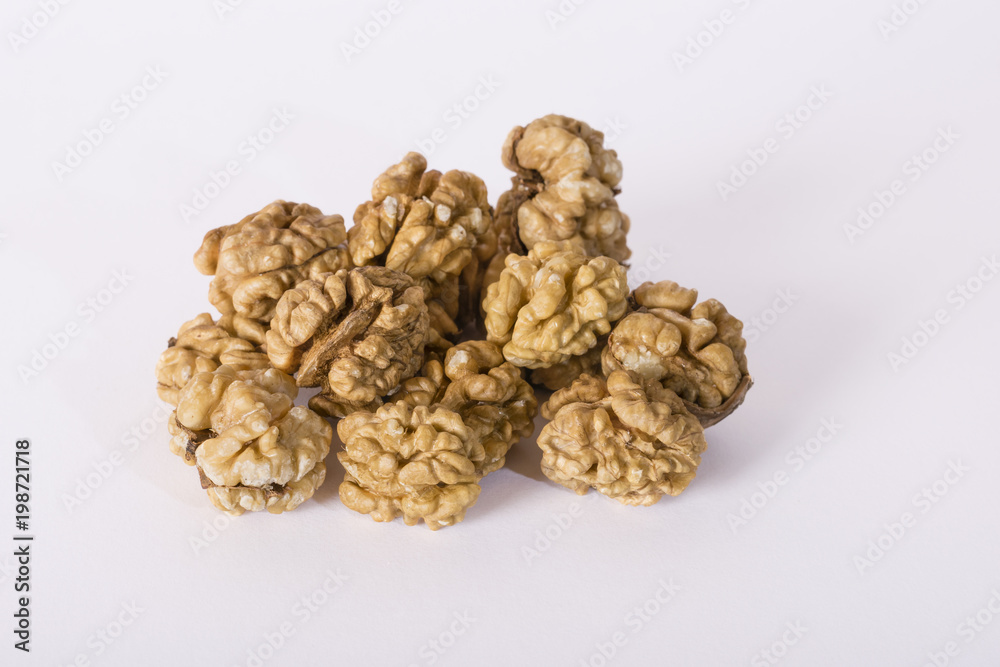 Shelled whole walnuts on white Shelled whole walnuts on white