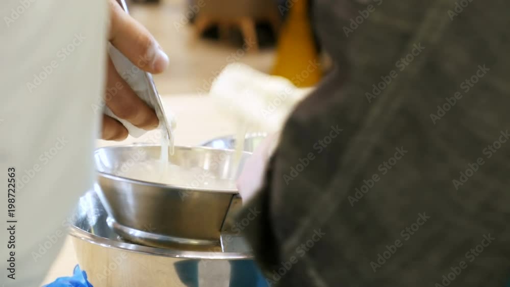 Man Pours Dairy into Strainer Chef Drafts Mixture Man Pours Dairy into Strainer Chef Drafts Mixture