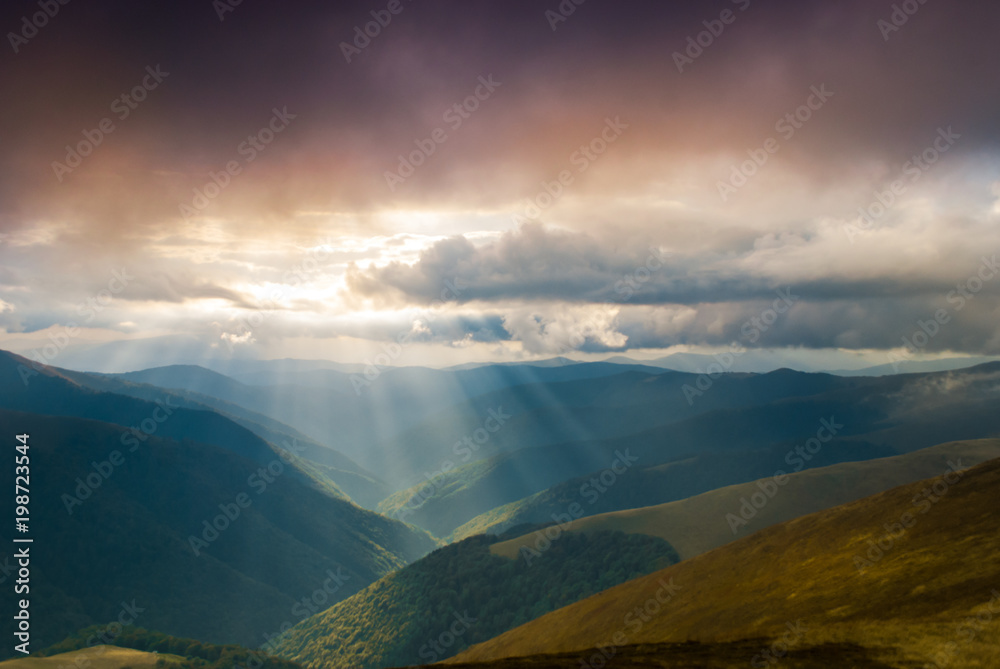 Sun rays over valley