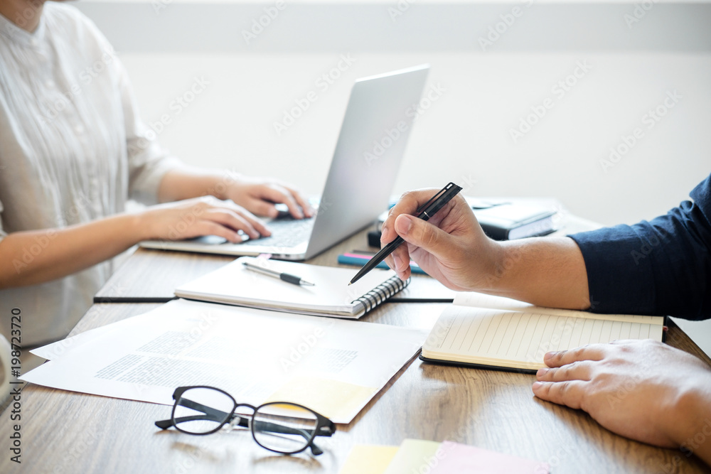 Two high school students campus or classmates with helps friend studying for a test an exam in workbook learning in classroom, Tutor books with friends, Education school concept Two high school students campus or classmates with helps friend studying for a test an exam in workbook learning in classroom, Tutor books with friends, Education school concept