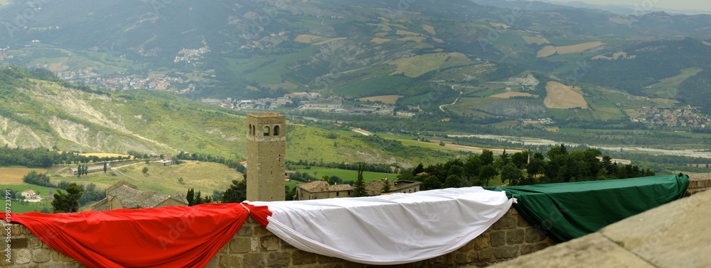 view from the fortress of San Leo with Italian tricolor