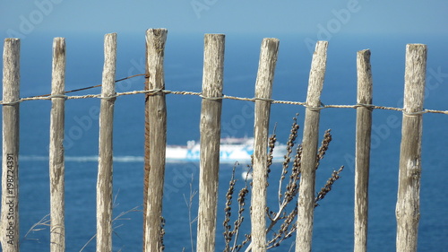 Wooden gate with sea background