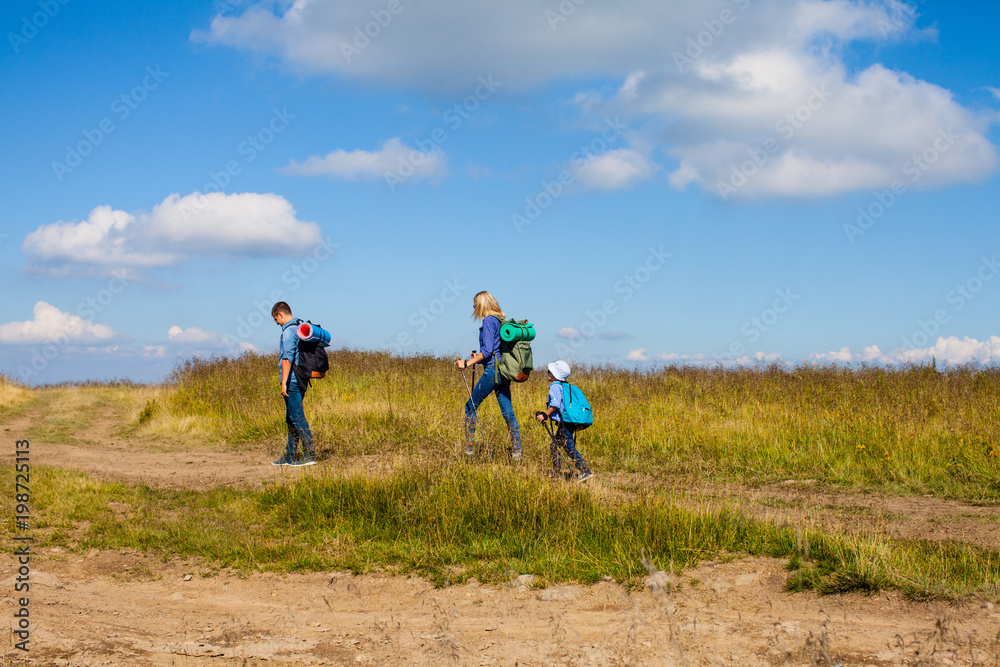 Family hiking in mountains