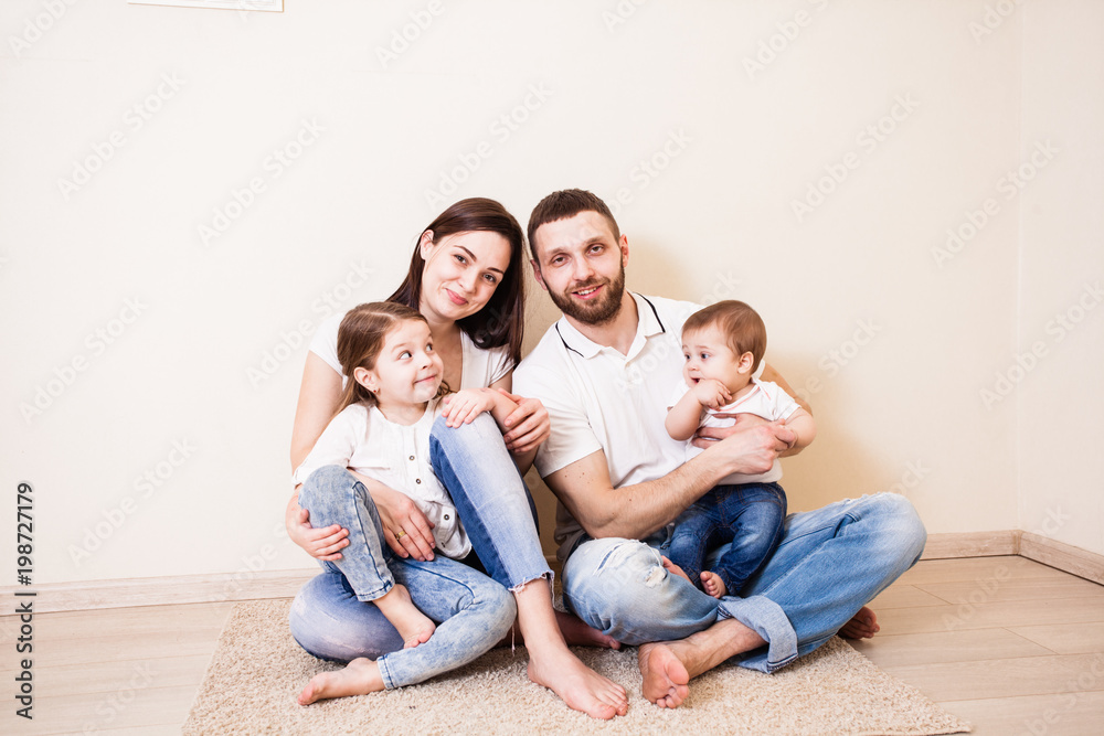 Portrait of a beautiful young family