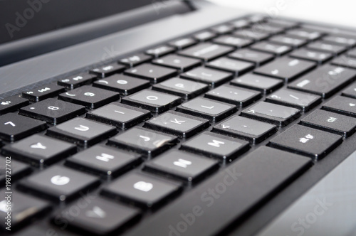 Keyboard of laptop closeup. Technology, business