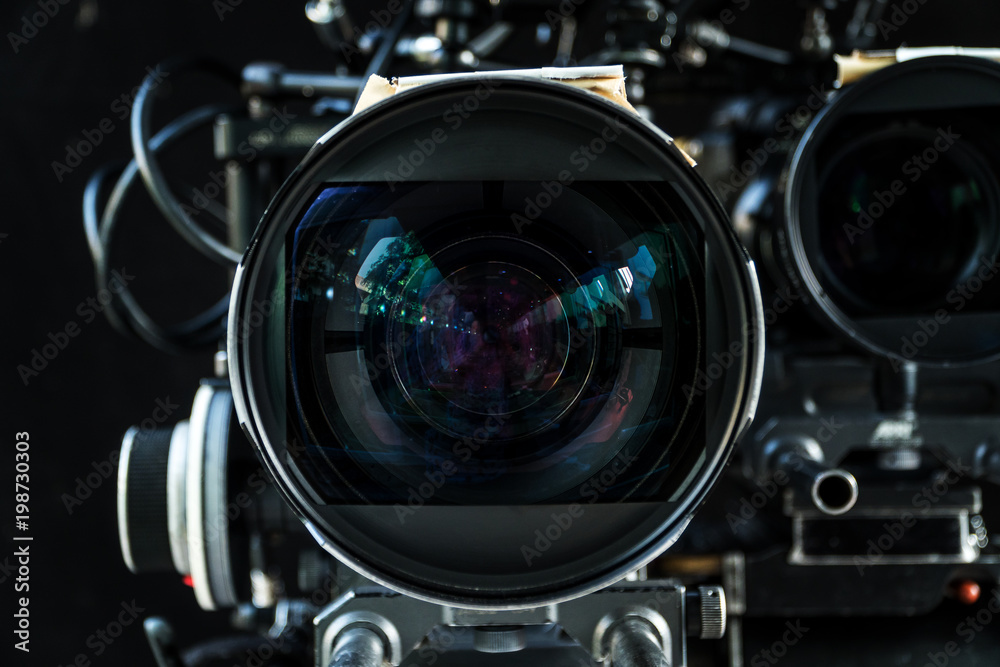 Close up shot of cinema lens with lot of equipment for filming cinema or movie in a division filming. Cinema lens. Photo lens.