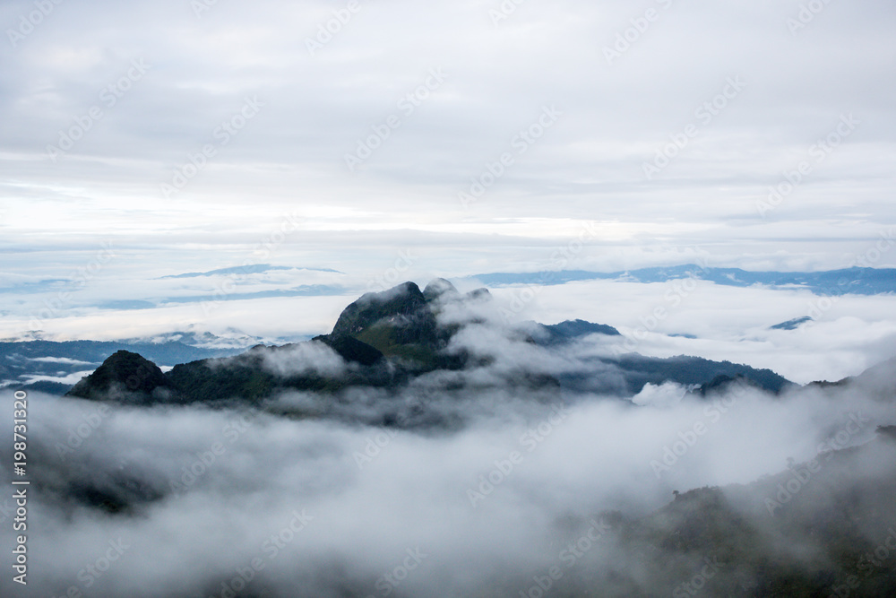 high mountain landscape background blue sky cloudy , fog around hill . nature national park at chiang dao Thailand . beautiful scene peak wildlife in winter .