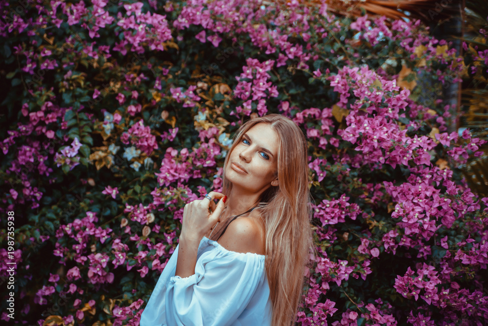 the girl on the background flowers the girl on the background flowers
