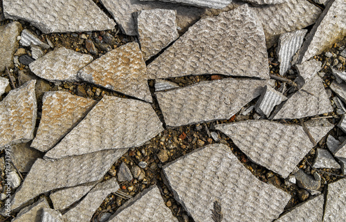 Pieces of broken gray slate. Broken slate background. Environmental pollution
