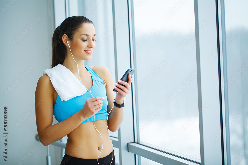 Portrait of young woman in sportswear, doing fitness exercise. Portrait of young woman in sportswear, doing fitness exercise.