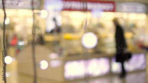 Wallpaper Mural The people who are washed away in a shot go in trade mall. defocused people in mall. people in mall Torontodigital.ca