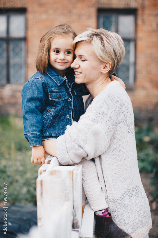 Fototapeta premium happy mother and daughter in park