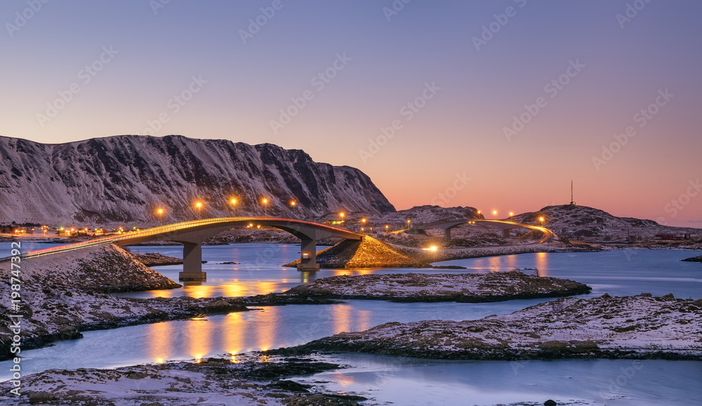 Bridge and high mountains during sunset. Natural landscape in the Norway