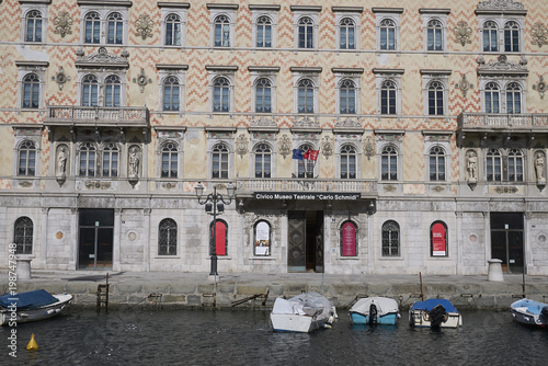 Trieste, Italy - March 19, 2018 : View of Canal Grande in Trieste and the Civico Museo Teatrale Carlo Schmidl building photo