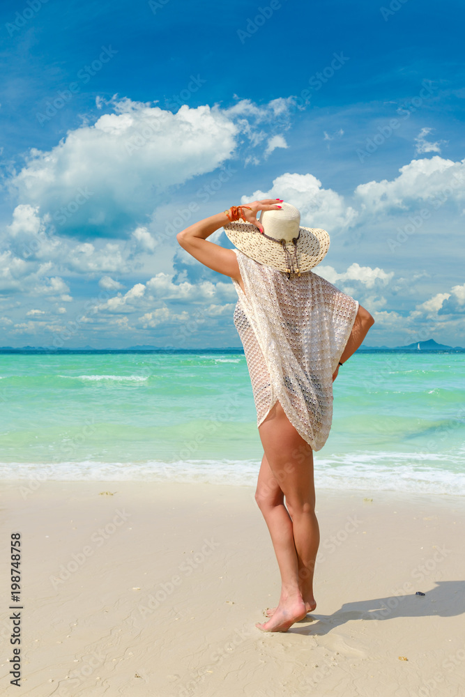 woman sunbathing on the tropical beach