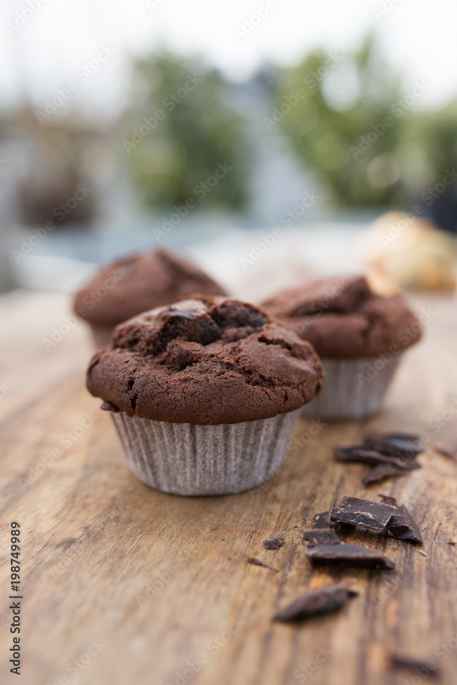 Chocolate muffin on a wooden table Chocolate muffin on a wooden table