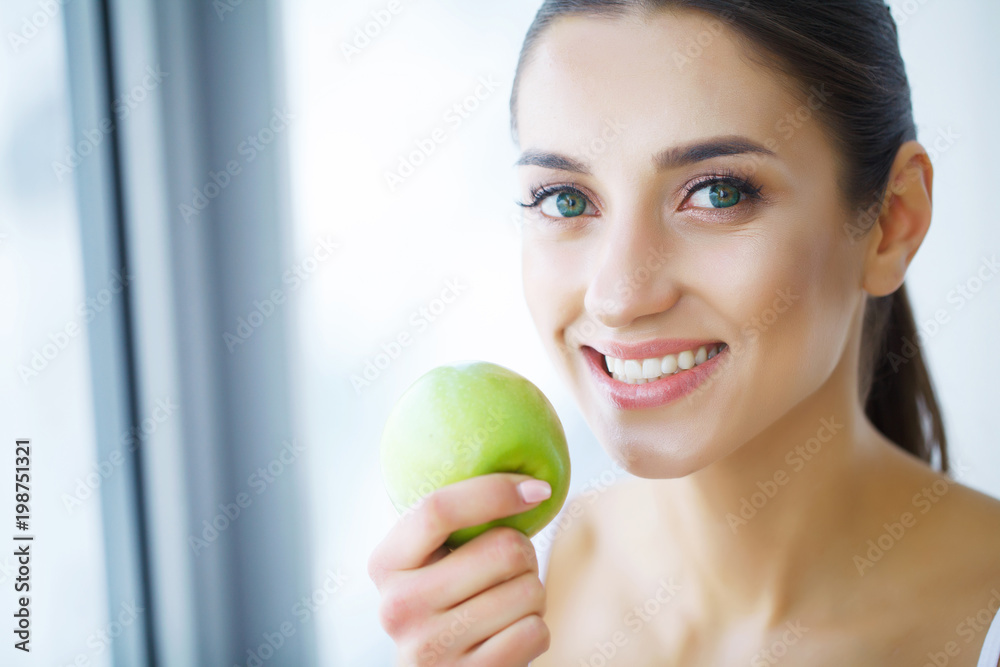 Woman With Apple. Beautiful Girl With White Smile, Healthy Teeth. High Resolution Image Woman With Apple. Beautiful Girl With White Smile, Healthy Teeth. High Resolution Image