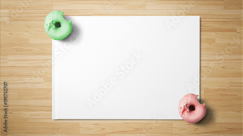 Donuts on white paper on wooden background