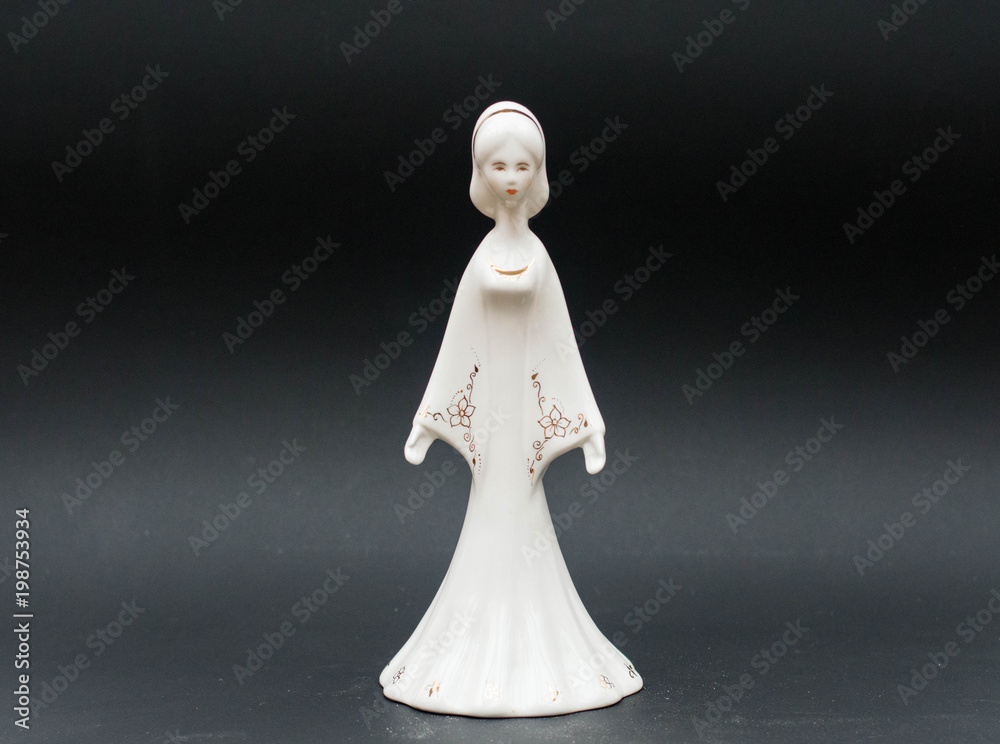 Snow white princess porcelain figurine isolated on black background Snow white princess porcelain figurine isolated on black background