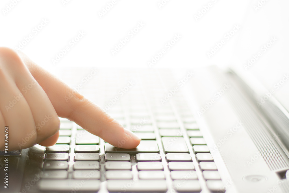Hands typing on a laptop keyboard Hands typing on a laptop keyboard