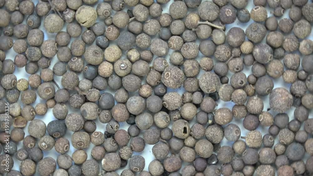 Rotating allspice food background Rotating allspice food background