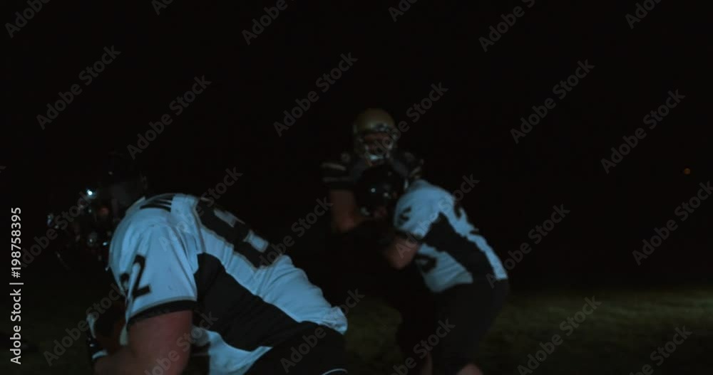 American football players in stadium during game American football players in stadium during game
