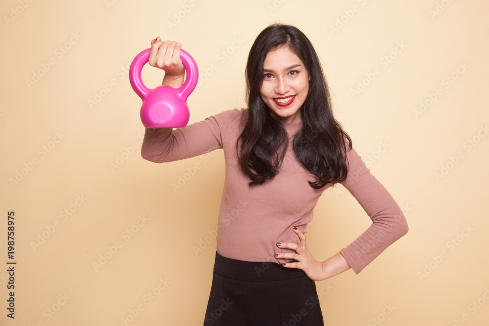 Exhausted Asian woman with dumbbells. Exhausted Asian woman with dumbbells.