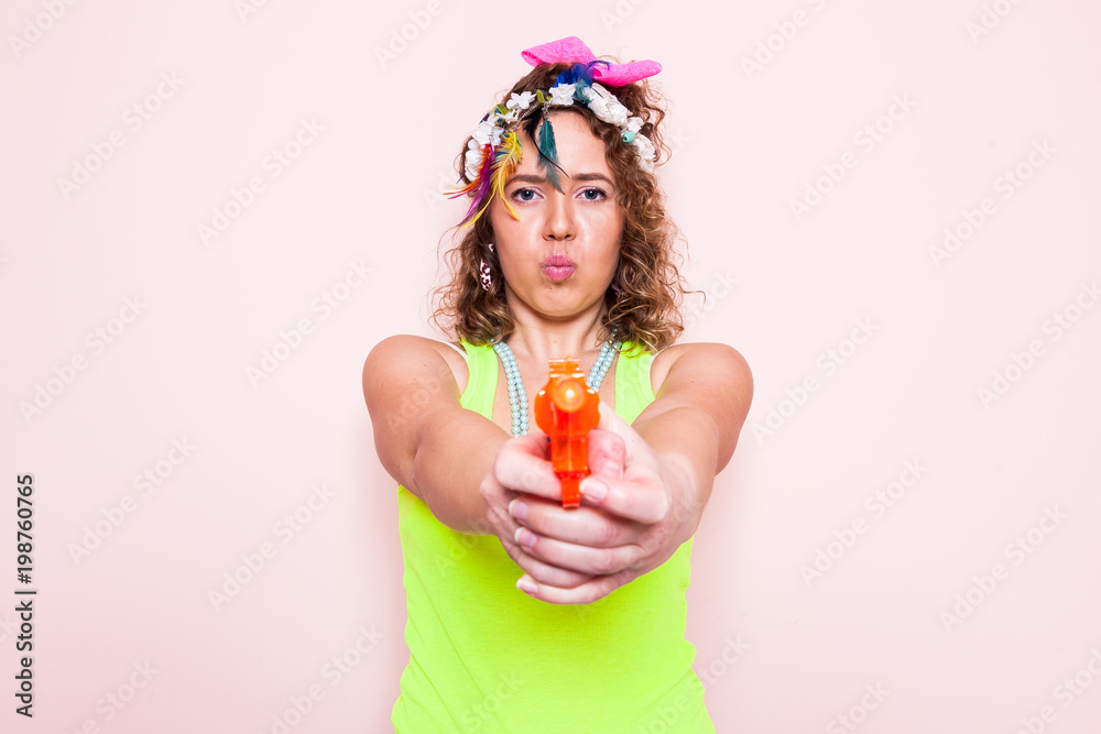 Happy woman wear 1980's style fashion on April fools day on color background with copy space. Happy woman wear 1980's style fashion on April fools day on color background with copy space.