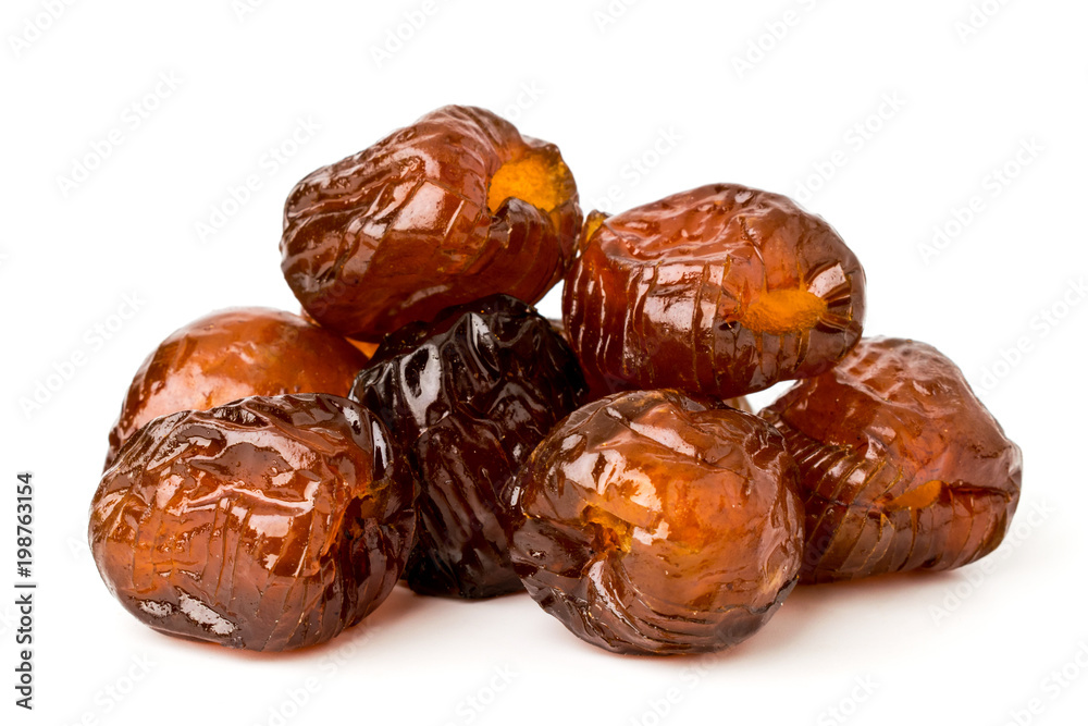 Pile of dried dates, pitted against a white background Pile of dried dates, pitted against a white background
