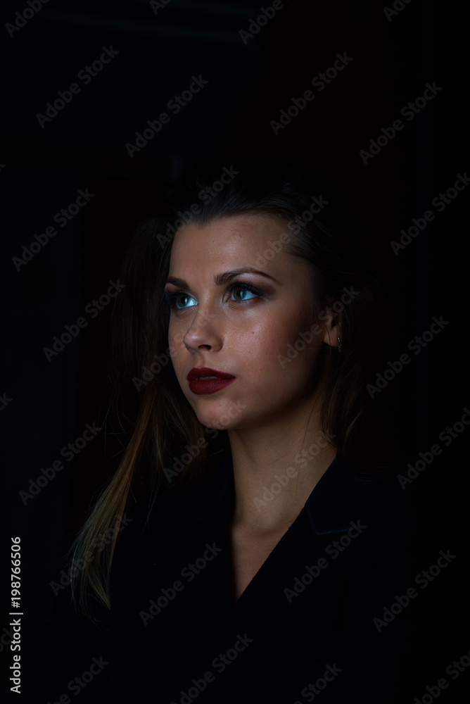 Sexy young blonde with red lips on a black background Sexy young blonde with red lips on a black background