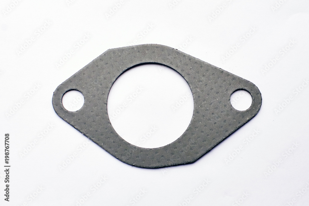 automotive steel gasket for the exhaust system isolated on white automotive steel gasket for the exhaust system isolated on white
