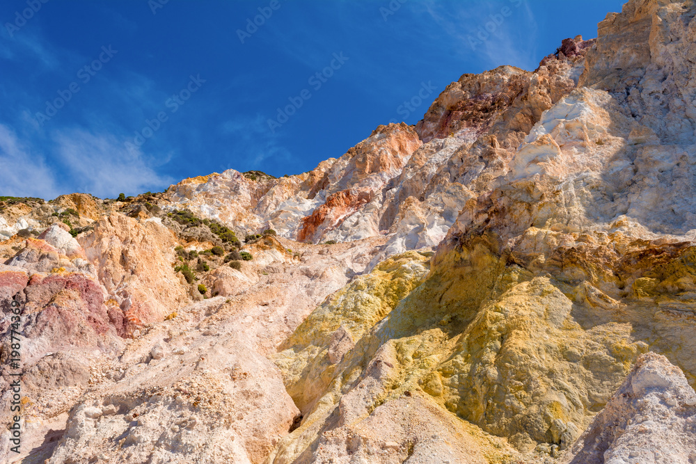 Multicolored rocks on Firiplaka Beach on Milos island. Cyclades, Greece