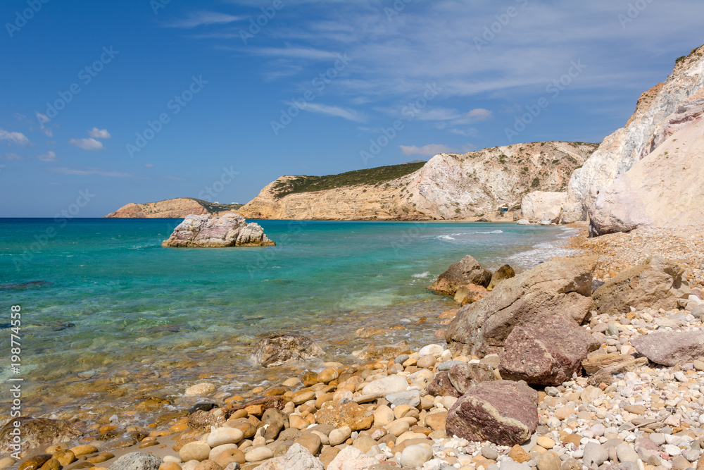 Rocks and blue sea water in summer day. Greece