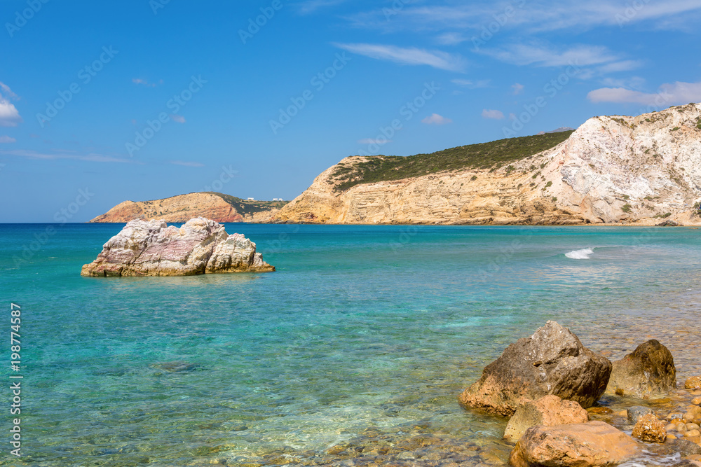 Rock formations and sea water on Firiplaka Beach, Milos island. Cyclades, Greece.