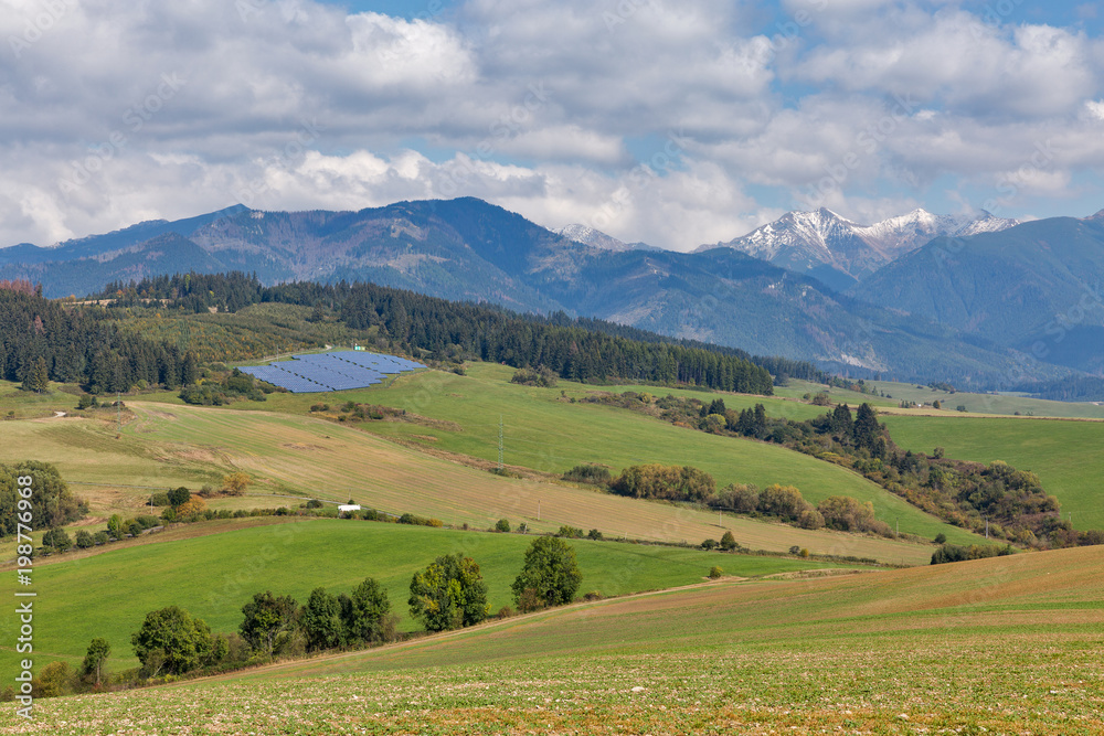 Summer hills landscape with solar panels in Slovakia.
