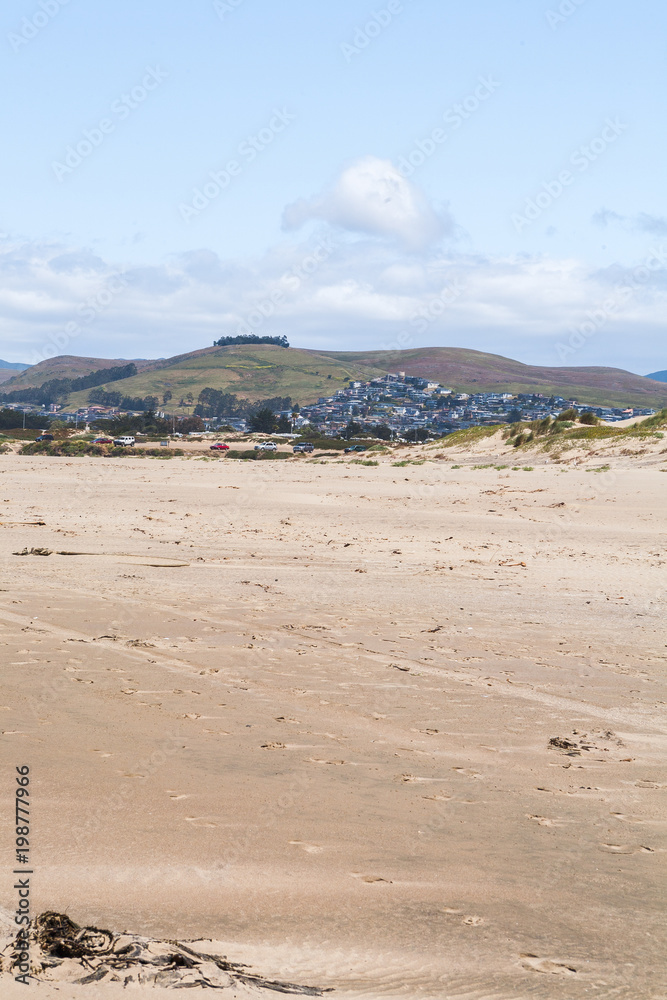 View from a beach of Hills in a distant, in Morrow Bay California