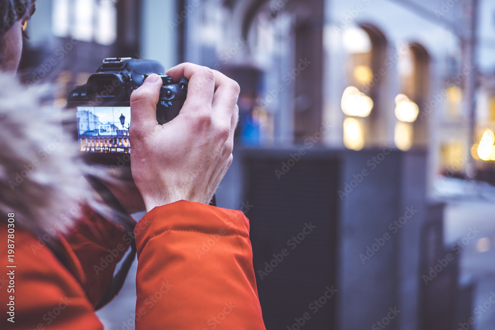 close up portrait of man taking pictures with dslr camera in the european street close up portrait of man taking pictures with dslr camera in the european street