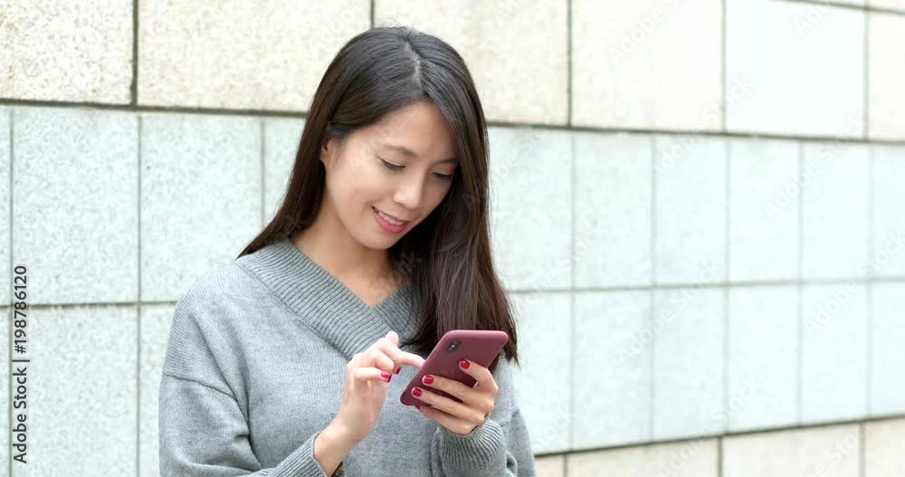 Woman use of mobile phone at outdoor Woman use of mobile phone at outdoor