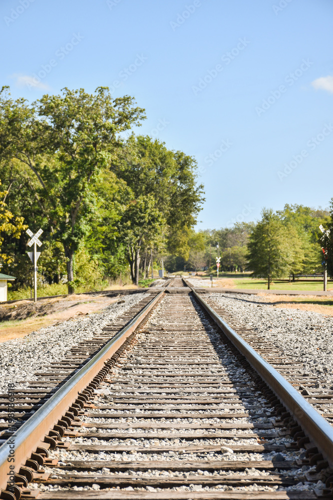 Straight railroad tracks disappearing in the distance
